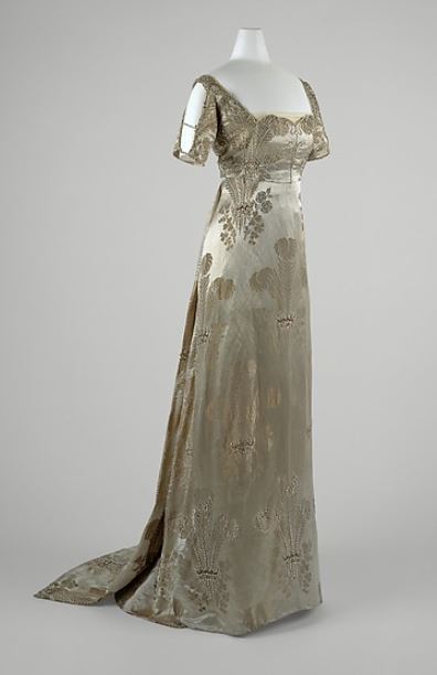 French evening gown, c. 1911. This is woven with what appear to be Prince of Wales feathers. A court presentation gown, perhaps? http://www.metmuseum.org/collection/the-collection-online/search/81103?rpp=30&pg=1&ao=on&ft=evening+dress&pos=5 