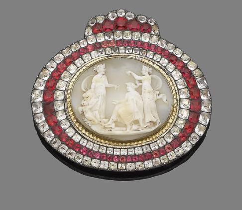A late 18th-century buckle of a cameo showing "the education of Cupid" framed in pastes http://www.bonhams.com/auctions/19760/lot/230